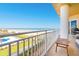 Enjoy the beautiful ocean view from this spacious balcony with white railing at 2855 S Atlantic Ave # 303, Daytona Beach Shores, FL 32118