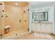 Beautiful bathroom features a spacious glass shower, vanity, mirror, and neutral color palette at 2855 S Atlantic Ave # 303, Daytona Beach Shores, FL 32118