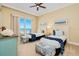 Inviting bedroom with two beds, ocean views from the balcony, and cozy coastal decor at 2855 S Atlantic Ave # 303, Daytona Beach Shores, FL 32118
