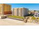 Beautiful condominium building with lush landscaping and beach access at 2855 S Atlantic Ave # 303, Daytona Beach Shores, FL 32118