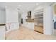Gourmet kitchen featuring modern stainless appliances, custom cabinetry and stone floors throughout at 2855 S Atlantic Ave # 303, Daytona Beach Shores, FL 32118