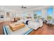 Expansive living room with ocean view, kitchen access and modern decor at 2855 S Atlantic Ave # 303, Daytona Beach Shores, FL 32118