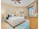 Spacious main bedroom features a large bed, ceiling fan, and access to a private balcony with ocean views at 2855 S Atlantic Ave # 303, Daytona Beach Shores, FL 32118