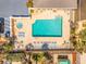 Aerial view featuring a pool and lounge area with many chairs, perfect for relaxation and enjoyment at 2855 S Atlantic Ave # 303, Daytona Beach Shores, FL 32118