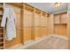 Large walk-in closet with custom built-in shelving and ample storage space at 2855 S Atlantic Ave # 303, Daytona Beach Shores, FL 32118