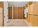 Well-organized walk-in closet with built-in shelving and mirror, maximizing storage space at 2855 S Atlantic Ave # 303, Daytona Beach Shores, FL 32118