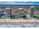 Stunning aerial view of beachfront condo towers with pools, parking, and lush landscaping, perfect for coastal living enthusiasts at 2900 N Atlantic Ave # 2003, Daytona Beach, FL 32118