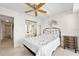 Cozy bedroom featuring a mirrored closet, ceiling fan, and comfortable furnishings at 2900 N Atlantic Ave # 2003, Daytona Beach, FL 32118