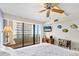 Bright bedroom boasts large windows and decor to create a relaxing space at 2900 N Atlantic Ave # 2003, Daytona Beach, FL 32118