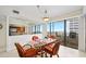 Inviting dining area with seating for four, a stylish chandelier, and ocean views at 2900 N Atlantic Ave # 2003, Daytona Beach, FL 32118