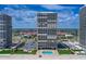 Scenic exterior view highlights modern condo towers with a refreshing pool area and beach access, creating an inviting coastal setting at 2900 N Atlantic Ave # 2003, Daytona Beach, FL 32118