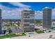 Striking exterior view showcases modern condo towers with a pool, lush landscaping, and beachfront access, offering a luxurious coastal lifestyle at 2900 N Atlantic Ave # 2003, Daytona Beach, FL 32118