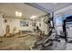 Well-equipped gym area features an elliptical, treadmill, and weightlifting equipment, providing residents with convenient fitness options at 2900 N Atlantic Ave # 2003, Daytona Beach, FL 32118