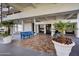 Inviting lobby area with tile floors, blue benches, and potted palm trees for a relaxing atmosphere at 2900 N Atlantic Ave # 2003, Daytona Beach, FL 32118