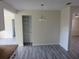 Dining room with modern gray floors, open storage, and a chandelier at 2936 Lantern Dr, South Daytona, FL 32119