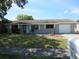 Charming single-story house featuring a garage and a well-maintained front lawn at 2936 Lantern Dr, South Daytona, FL 32119