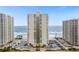 An eye-level exterior shows the beachfront condos, parking, and lovely landscaping at 2947 S Atlantic Ave # 201, Daytona Beach Shores, FL 32118