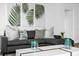 Close up of a stylish sectional sofa in a bright living room with contemporary decor and accents at 2947 S Atlantic Ave # 201, Daytona Beach Shores, FL 32118