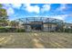 Home's screened-in pool area is fenced in the backyard, creating a private outdoor oasis at 302 Lamberton Ln, Deland, FL 32724
