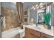 Bathroom featuring a single vanity, granite counters, and shower/tub combo at 302 Lamberton Ln, Deland, FL 32724