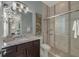 Bathroom featuring a single vanity, granite counters, and tiled walk-in shower at 302 Lamberton Ln, Deland, FL 32724