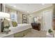 This bedroom features an accent wall, plush carpeting, and large window at 302 Lamberton Ln, Deland, FL 32724