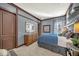 Bedroom with blue color scheme, stylish decor, and plenty of natural light at 302 Lamberton Ln, Deland, FL 32724