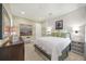 This bedroom features an accent wall, crown moulding, and stylish furnishings at 302 Lamberton Ln, Deland, FL 32724