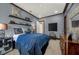 Bedroom with blue color scheme, stylish decor, and built-in shelving at 302 Lamberton Ln, Deland, FL 32724