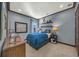 Bedroom with blue color scheme, stylish decor, and plenty of natural light at 302 Lamberton Ln, Deland, FL 32724