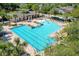 Stunning community pool featuring lounge areas, water features, and comfortable seating surrounded by lush landscaping at 302 Lamberton Ln, Deland, FL 32724