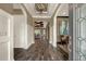 Spacious foyer with rich hardwood flooring, detailed trim work, and an inviting view into the living areas at 302 Lamberton Ln, Deland, FL 32724