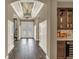 Elegant foyer showcasing beautiful hardwood floors, archways, and a stylish ceiling design at 302 Lamberton Ln, Deland, FL 32724