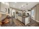 Bright kitchen with stainless steel appliances, granite countertops, and open layout at 302 Lamberton Ln, Deland, FL 32724