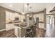 Modern kitchen features a large island, stainless steel appliances, and custom cabinets at 302 Lamberton Ln, Deland, FL 32724