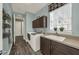 Laundry room featuring tiled floor, modern appliances, and plenty of storage at 302 Lamberton Ln, Deland, FL 32724