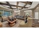 Spacious living room boasts a coffered ceiling, stylish furnishings, and open floor plan at 302 Lamberton Ln, Deland, FL 32724