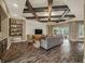 Open-concept living area with coffered ceiling, TV, and view of the outdoor patio at 302 Lamberton Ln, Deland, FL 32724