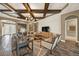 Bright living room with decorative wood beams, fireplace, and view to front door at 302 Lamberton Ln, Deland, FL 32724