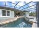 Screened-in pool and spa area with beautiful brick patio, perfect for outdoor relaxation and enjoyment at 302 Lamberton Ln, Deland, FL 32724