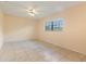 Bedroom with tile flooring, ceiling fan, and a window view at 303 E Floral Ave, Eustis, FL 32726