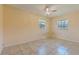 Bedroom showcasing tile floors and a ceiling fan at 303 E Floral Ave, Eustis, FL 32726