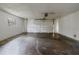 View of the spacious two car garage featuring a window and an automatic door opener at 303 E Floral Ave, Eustis, FL 32726