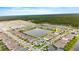 Aerial view of the houses in the neighborhood and the trees in the distance at 3120 Areca Ave, New Smyrna Beach, FL 32168