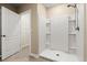 Bathroom with a walk-in shower stall, and tile floors with access to the closet at 3120 Areca Ave, New Smyrna Beach, FL 32168
