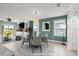 Dining room with tile floors, large windows, and modern furniture at 3120 Areca Ave, New Smyrna Beach, FL 32168