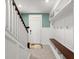 Inviting entryway featuring a bench, storage cubbies, and a door with decorative glass at 3120 Areca Ave, New Smyrna Beach, FL 32168