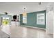 Open living room with tiled floors, modern paint, and built in entertainment center at 3120 Areca Ave, New Smyrna Beach, FL 32168
