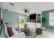 View of a living room area featuring built-in shelving and cabinets, plus a comfortable couch and decor at 3120 Areca Ave, New Smyrna Beach, FL 32168
