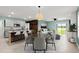 Bright, open floor plan with modern kitchen, dining area, and comfortable living space with views of the lake at 3120 Areca Ave, New Smyrna Beach, FL 32168